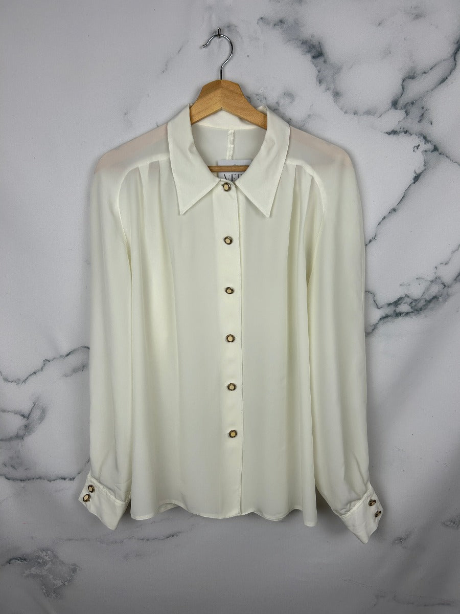 Blusa vintage blanca con bonita caída